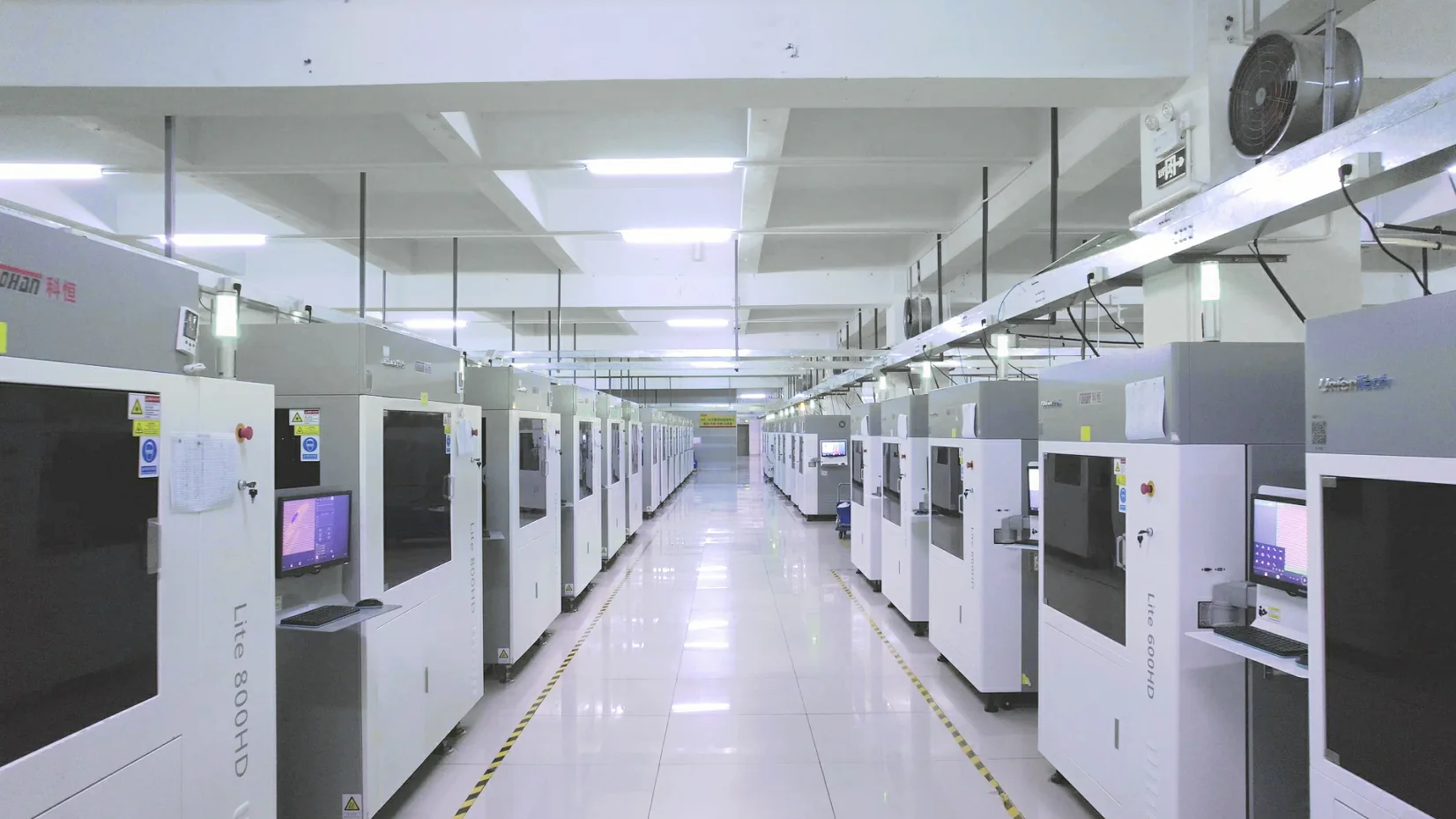Rows of plastic injection molding machines in a Chinese factory