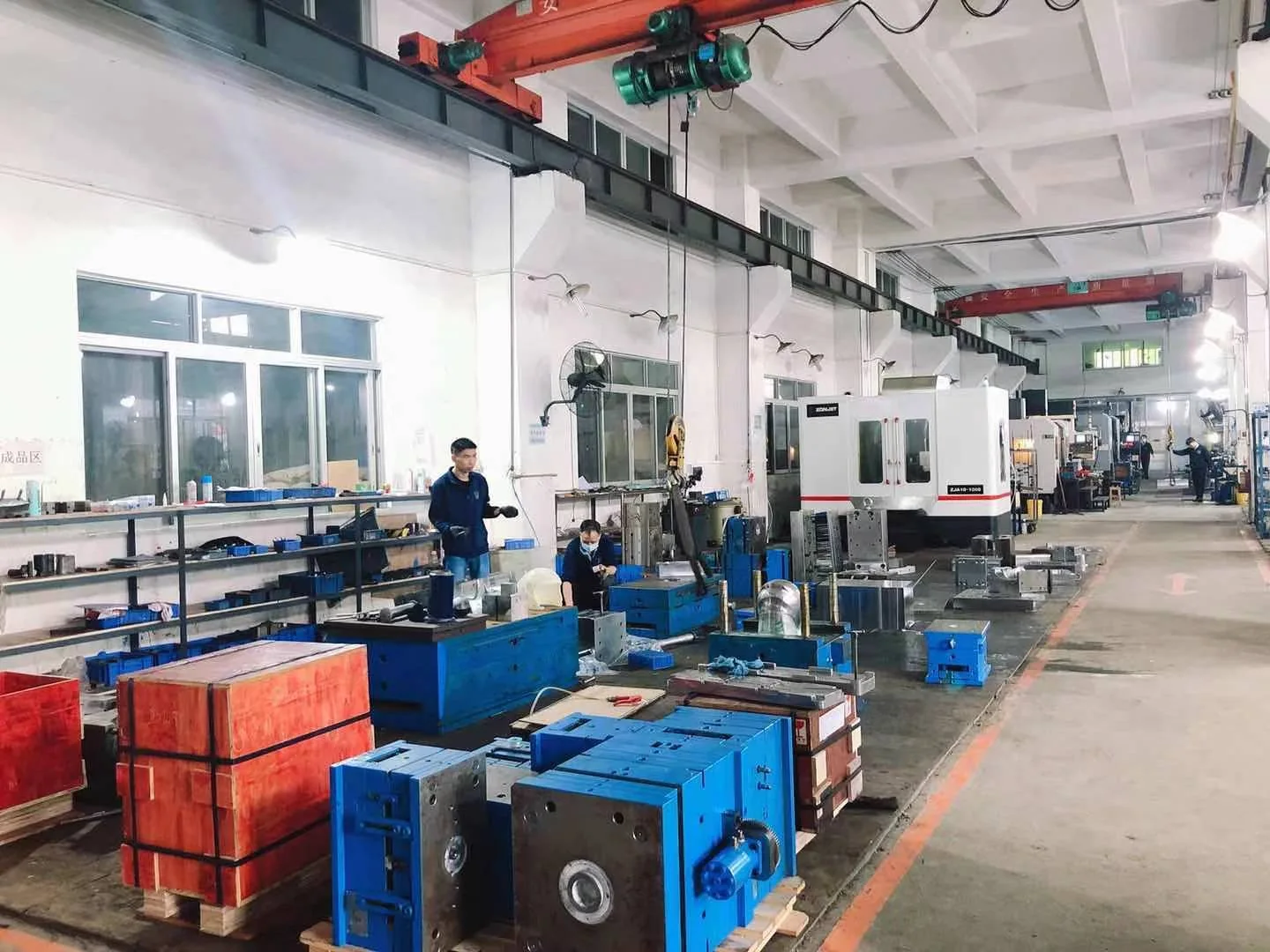 Injection mold fabrication and preparation in a Chinese workshop